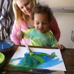 toddlers playing with paint