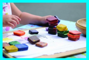 child playing with colour blocks