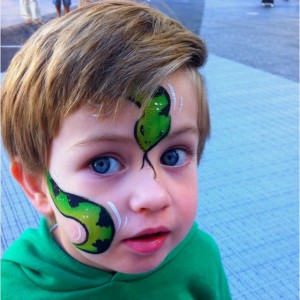 boy with snake design face paint kids make-up