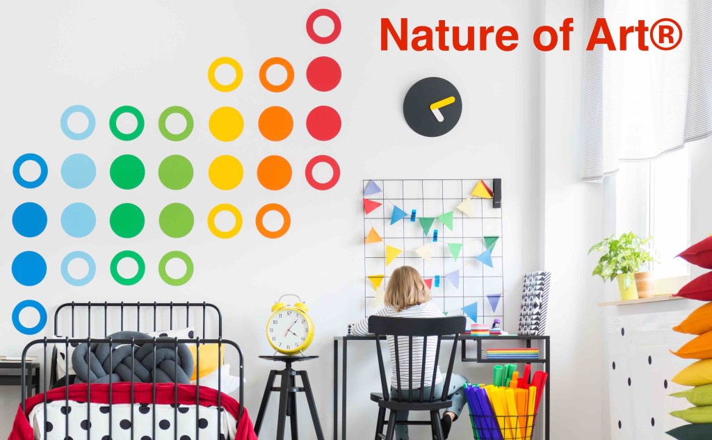 Geometric carpet in spacious bright kid's room with red bedding on the bed, toys on a shelf and black chair at a desk