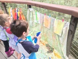 action painting with stray bottles and watercolor paint